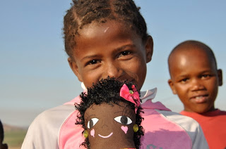 A child in Africa with her new dolly