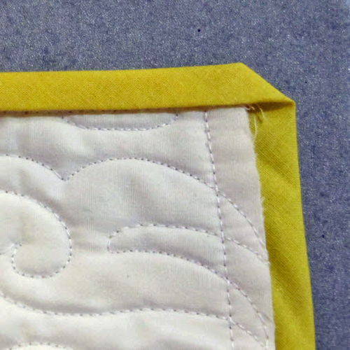 Quilting Basics: How to Fold a Mitered Corner - WeAllSew