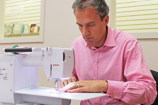 man at sewing machine