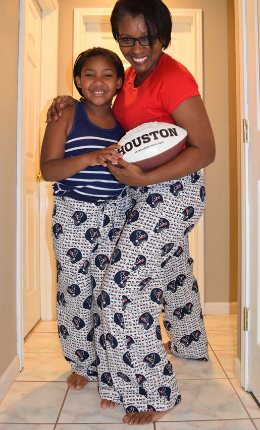 woman and girl in matching pajamas