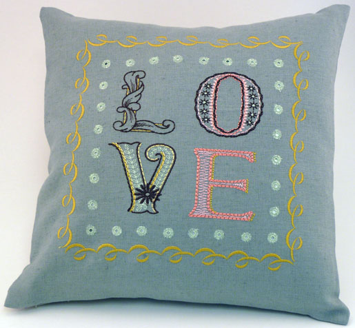 pillow with embroidery and eyelets