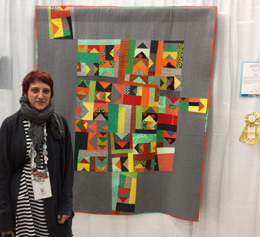 Tricia Royal with her quilt, This Way