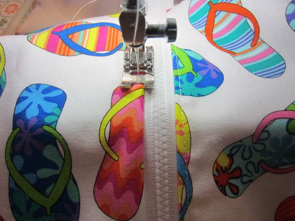 Swim Wetbag Sewing Tutorial - Topstitch fabric layers 1/8” away from finished edge