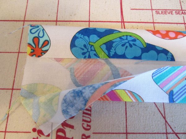 Swim Wetbag Sewing Tutorial - 5.	Fold 4 x 18” strip in half lengthwise