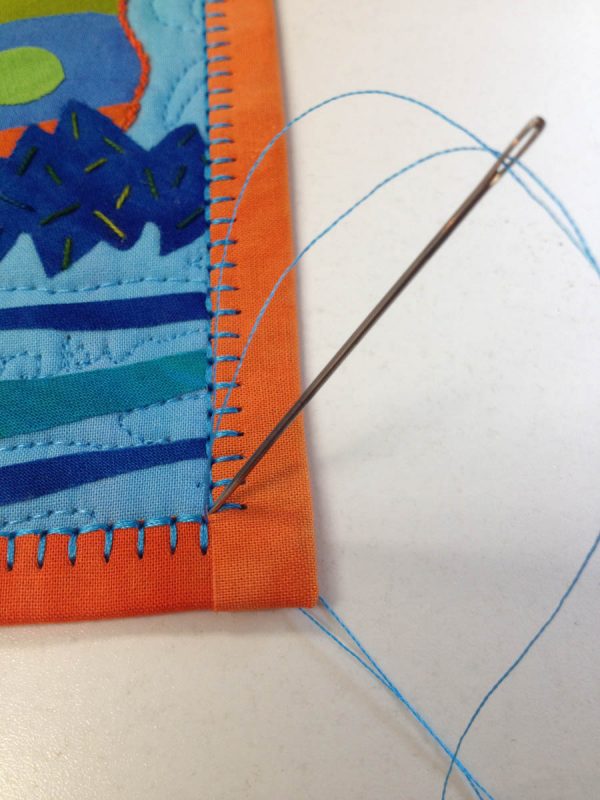Binding Stitch Tip - bring top thread to the back of the quilt at the corner