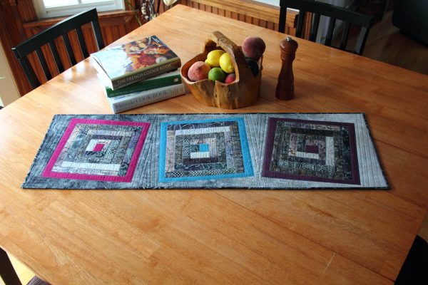 Fused Log Cabin Table Runner Tutorial - finished table runner on table