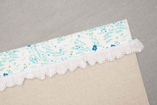 Easter Fabric Basket Tutorial - Top stitch the lace along the seam line