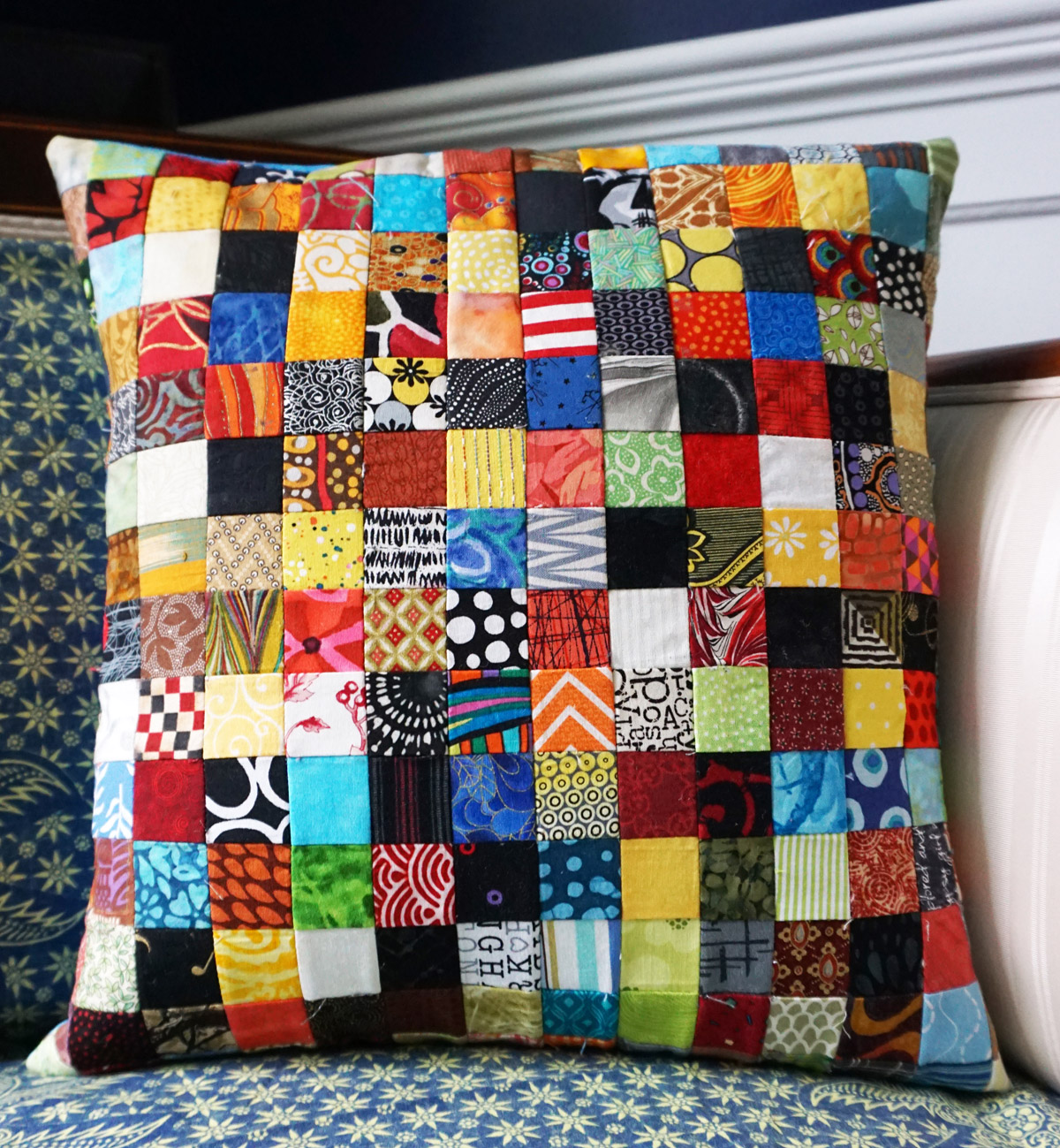 Postage stamp patchwork pillow