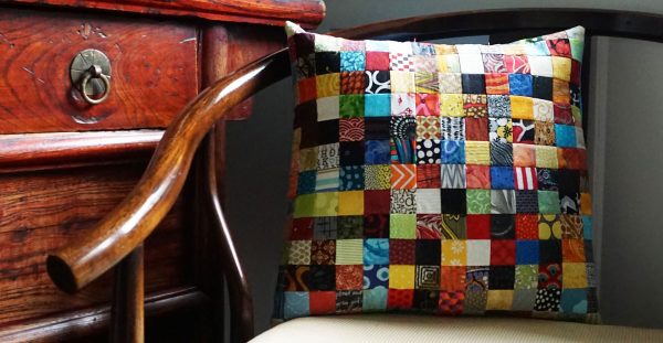 Postage stamp patchwork pillow