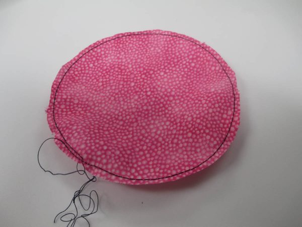 How to Create Yo-Yos with the BERNINA Circular Embroidery Attachment - trim the fabric circle ¼” outside the stitching line