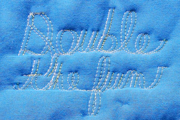 Double Needle Free Motion Quilting Cursive Wording