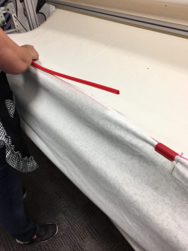 Attaching top edge of backing fabric 