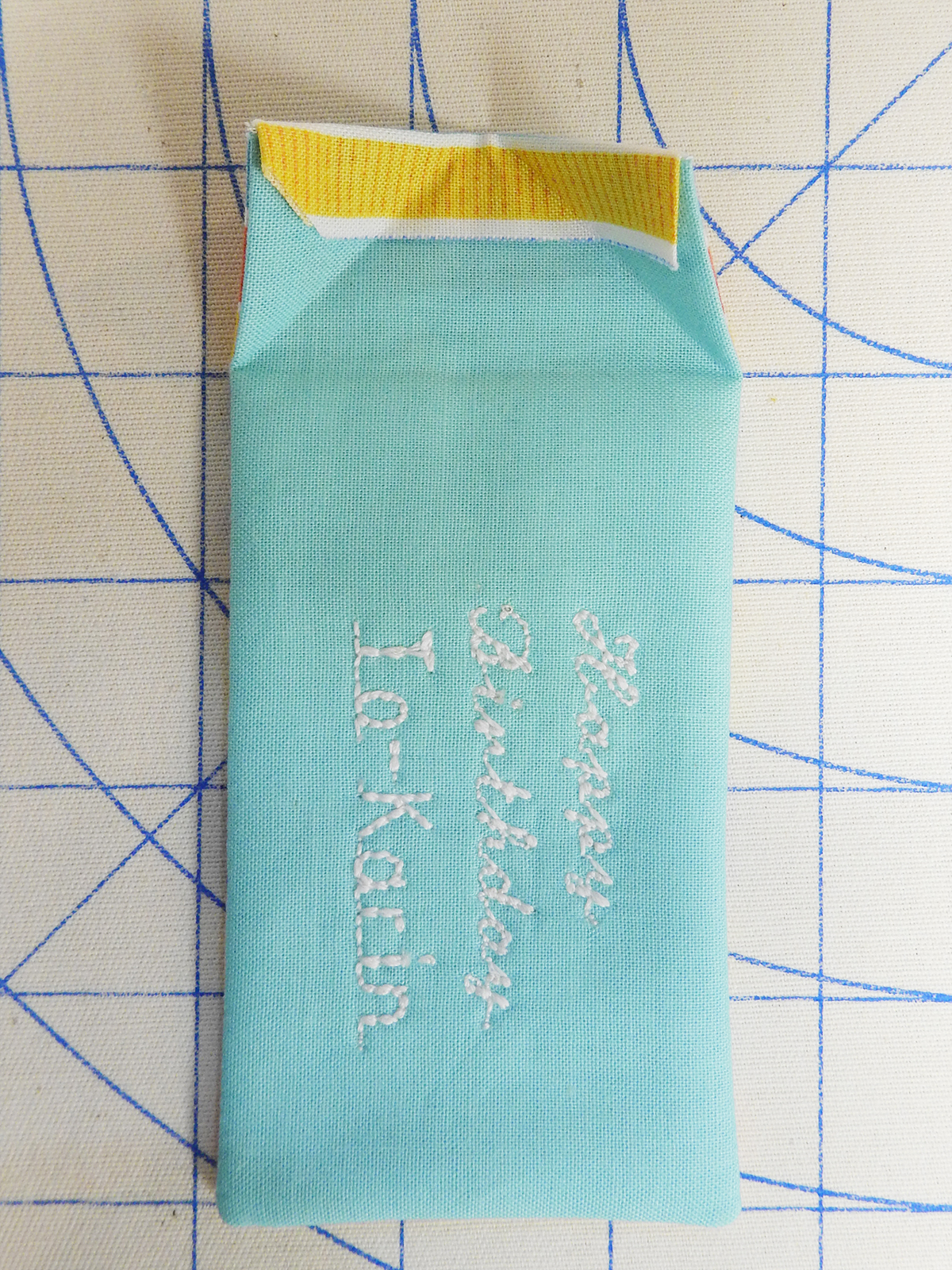 Personalized Fabric Gift Tag Steps 8 & 9: Pressing the top edge of the gift tag.