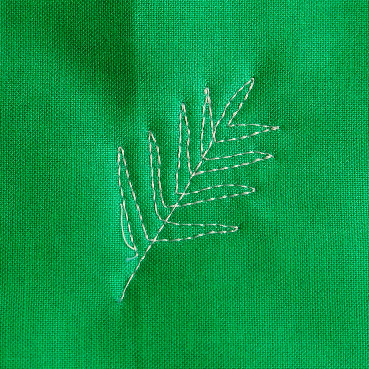 Free-motion Quilting Pine Boughs and Holly-stitching the top