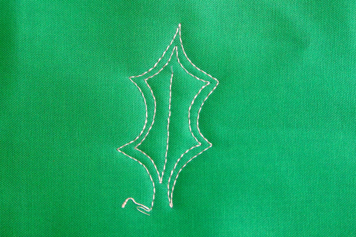 Free-motion Quilting Pine Boughs and Holly-stitch into the center to create a vein