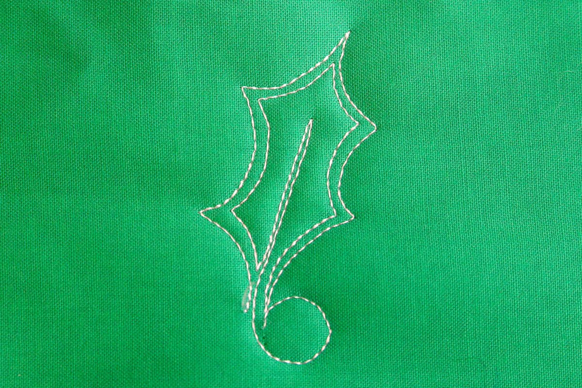 Free-motion Quilting Pine Boughs and Holly-Closely echo stitch the vein