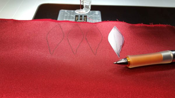 Poinsettia Pin-Trace the larger petal shape onto the fused satin and felt