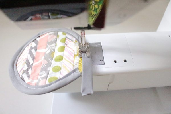 Modern Patchwork Coasters Tutorial Step Eleven: sew bias tape on edge