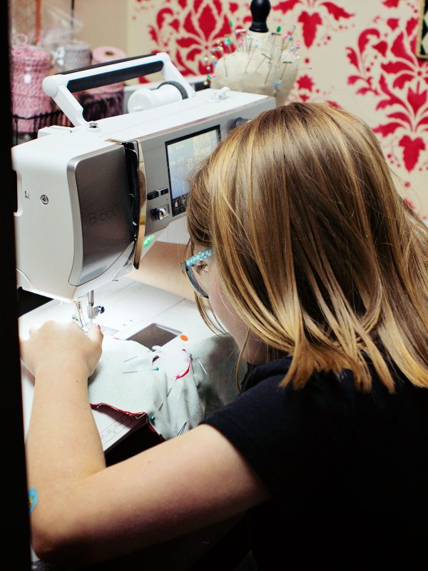 little girl at BERNINA 560 machine