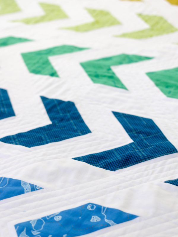 Arrow Baby Quilt with Half-Square Triangles by Lee Heinrich