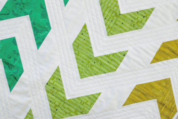 Arrow Baby Quilt with half-square triangles by Lee Heinrich