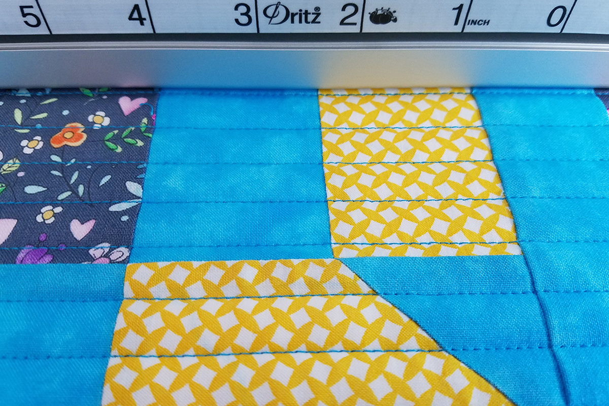 Straight Line Quilting with Q-matic, check quilting