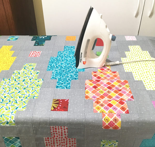 Press the quilt to set the glue.