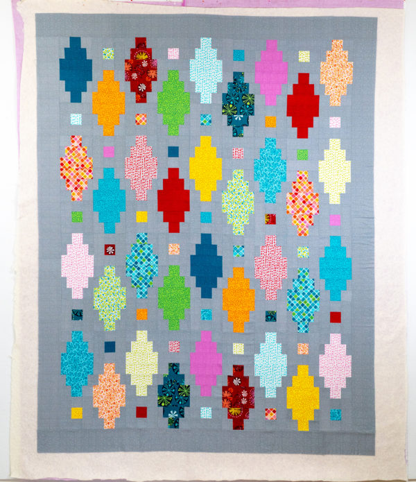 Basting Beaded Lanterns Quilt Top