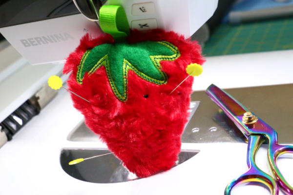 we all sew how to embroider on cuddle luxe in the hoop strawberry pin cushion