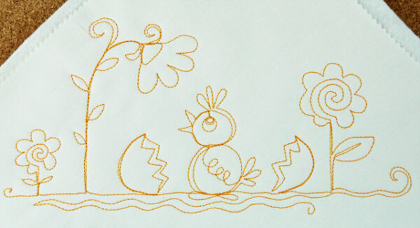 Free-motion stitched baby chicks motif