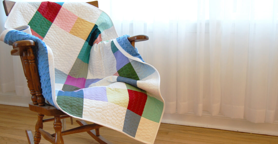 Minki Backed Patchwork Baby Quilt tutorial at WeAllSew