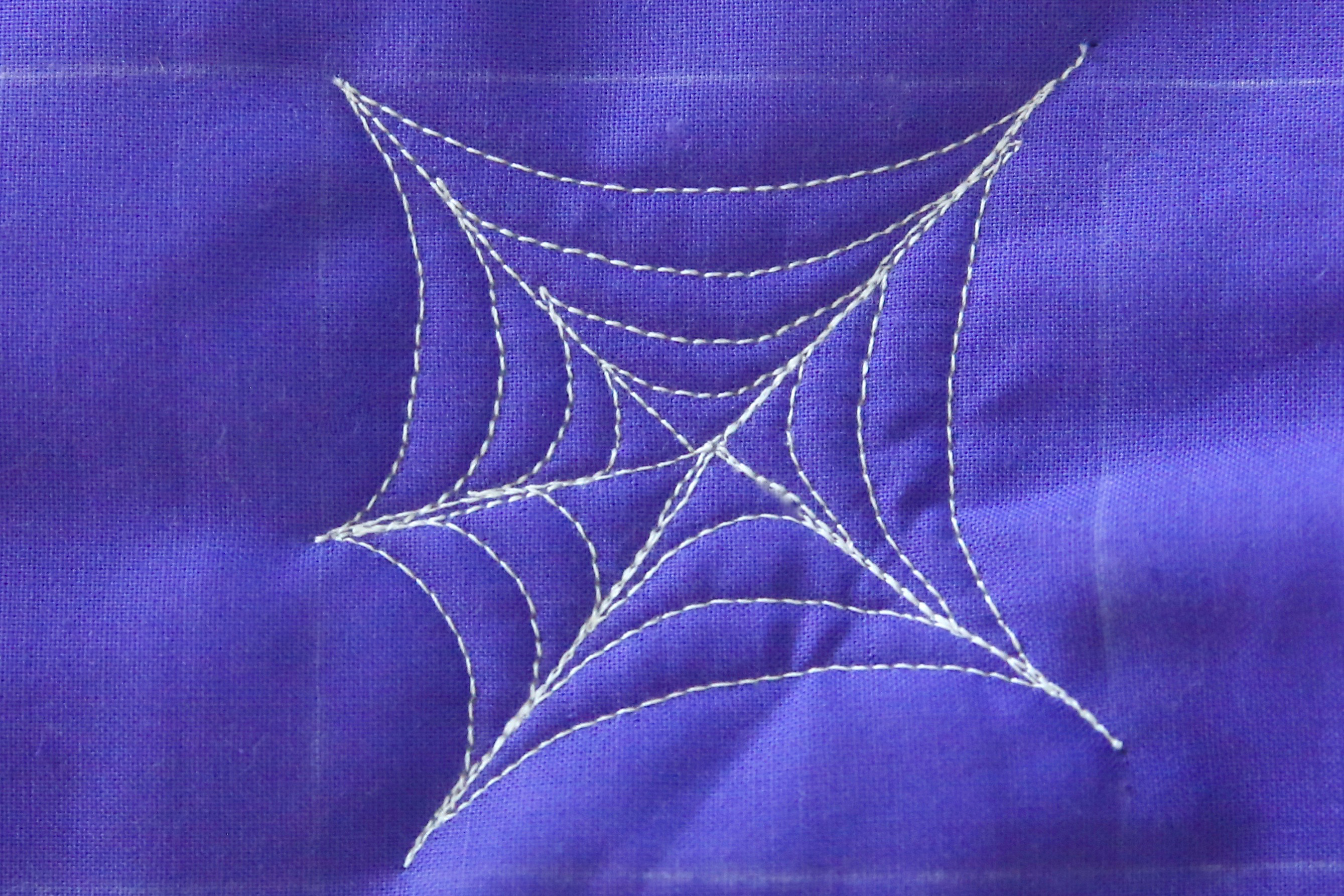 How to free-motion quilt a spider web and spider - step six