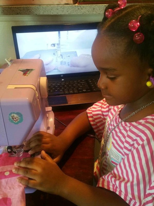 Paris is practicing her sewing skills