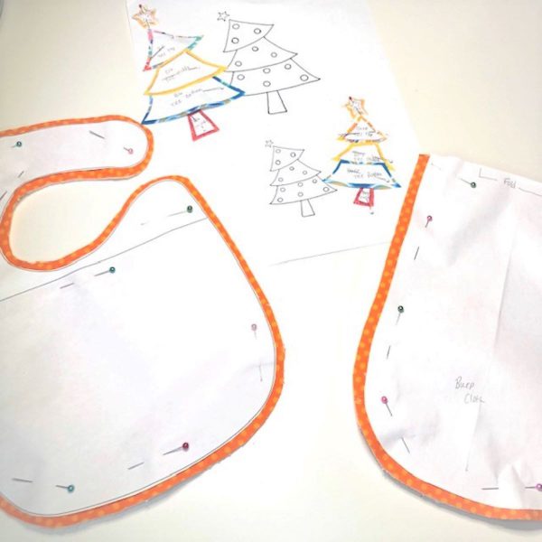 Appliqued Bib Burp Cloth Set Tutorial: fusible applique pieces in place