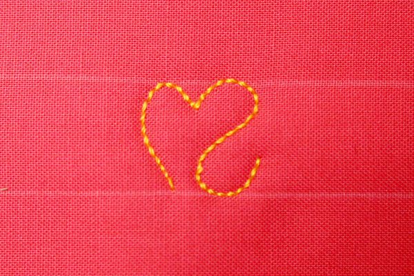 Free Motion Quilt Hearts in a Border - Right side with backwards S