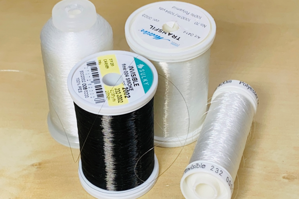 ST OF 6 SPOOLS OF CLEAR THREAD 