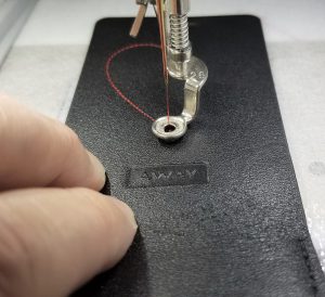 Embroidered_Luggage_Tag_18_Basting_line_being_stitched_BERNINA_WeAllSew_Blog_1200x1025px