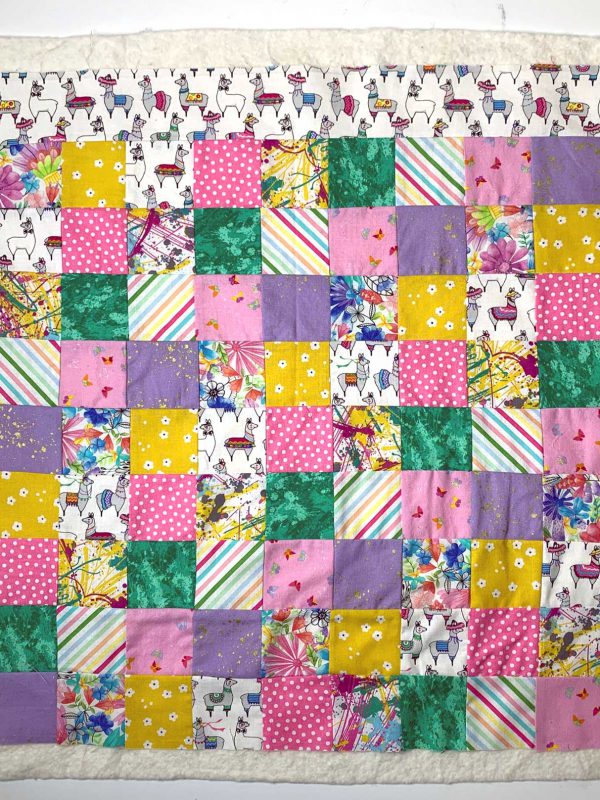 Place patchwork top on batting