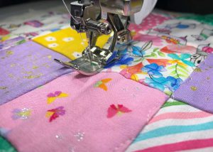 Stipple stitch on doll quilt
