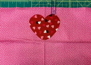 Center first heart on apron bottom band