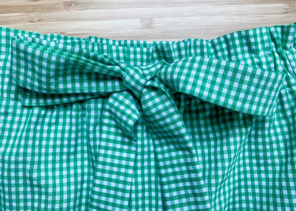 tie a bow at the center front of the shorts