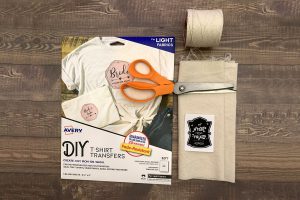 Photo of supplies including pinking shears, fabric, cotton cording and Avery 3271 t-shirt transfer paper