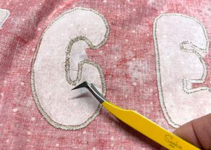 remove backing with sookie sews angled tweezers