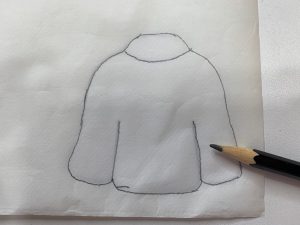 Trace sweater onto fusible web