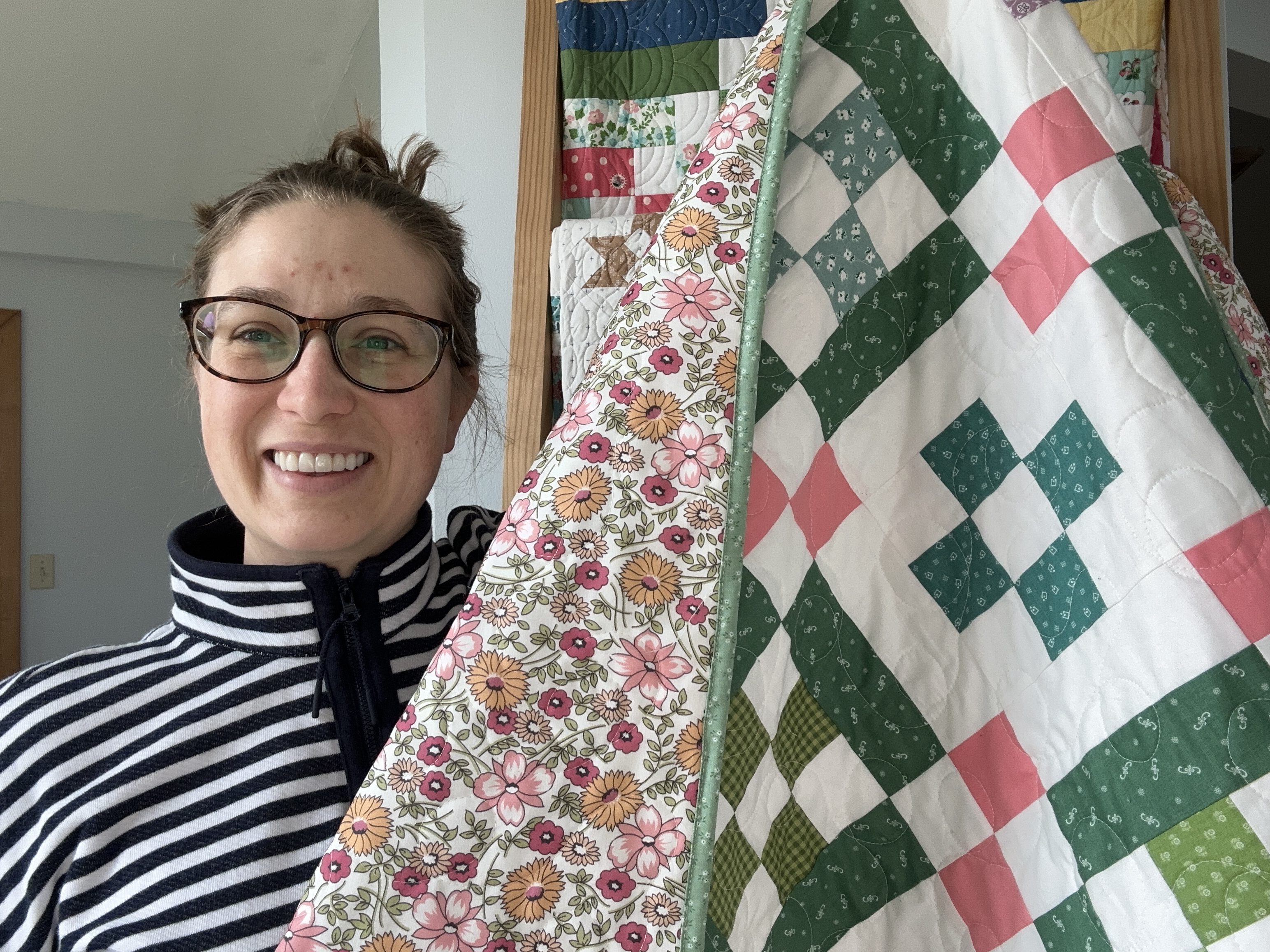 Jessica Dayon and the completed quilt Nona Quilt from the Nona Along BERNINA WeAllSew blog