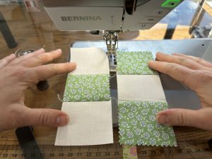 Assembling the rows of a Nine Patch for the Nona Quilt Along BERNINA WeAllSew blog