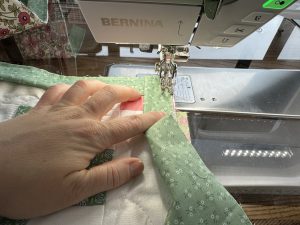 Binding a corner for the Nona Quilt Along BERNINA WeAll Sew blog