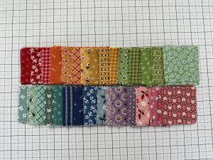 A rainbow of 2 1/2" squares for the Nona quilt