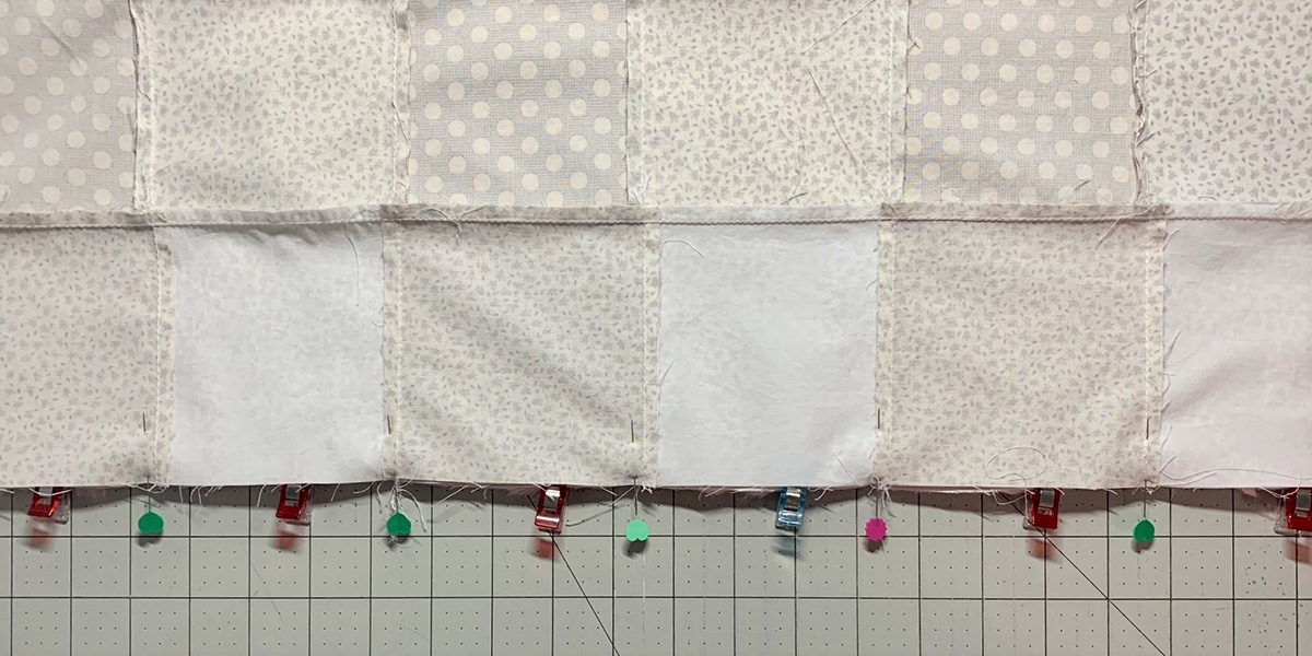 Serger_Baby_Quilt_#2_Post_07_top_flipped_over_and_secured_BERNINA_WeAllSew_Blog_1200x600px