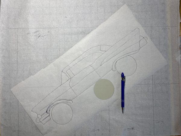 The pieced background appears in the bottom layer while the car design is on top. 